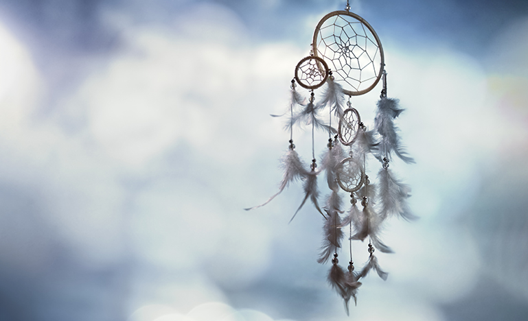 Dream catcher on blue background