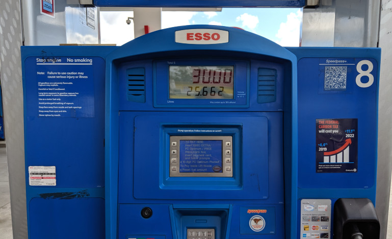 Gas pump with gas sticker