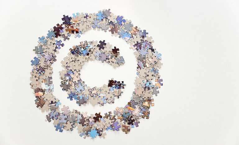 Large copyright sign made of jigsaw puzzle pieces