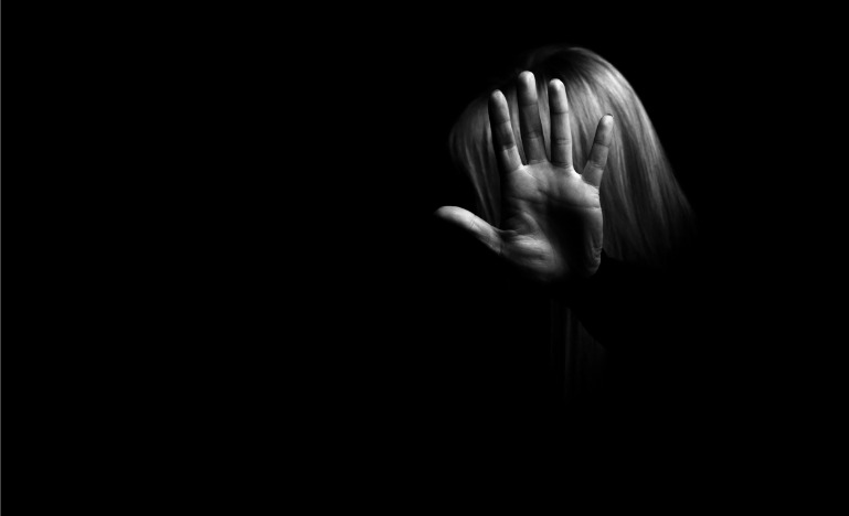 Woman holding hand out in stop gesture