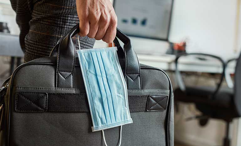 Man with a briefcase and mask