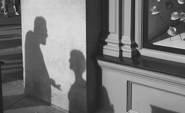 shadow of two people having conversation