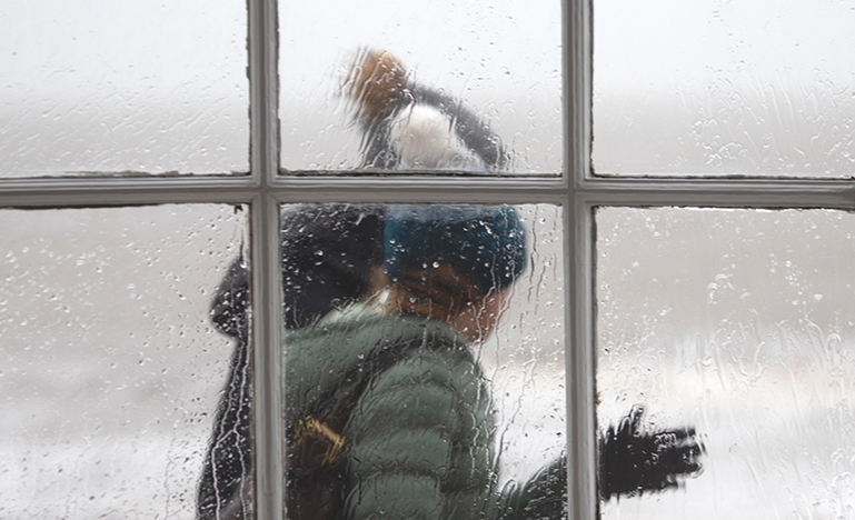 people walking outside in stormy weather